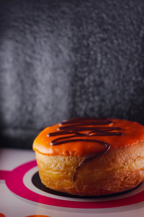 Безкоштовне стокове фото на тему «dunkin пончики, апельсин, вершковий»