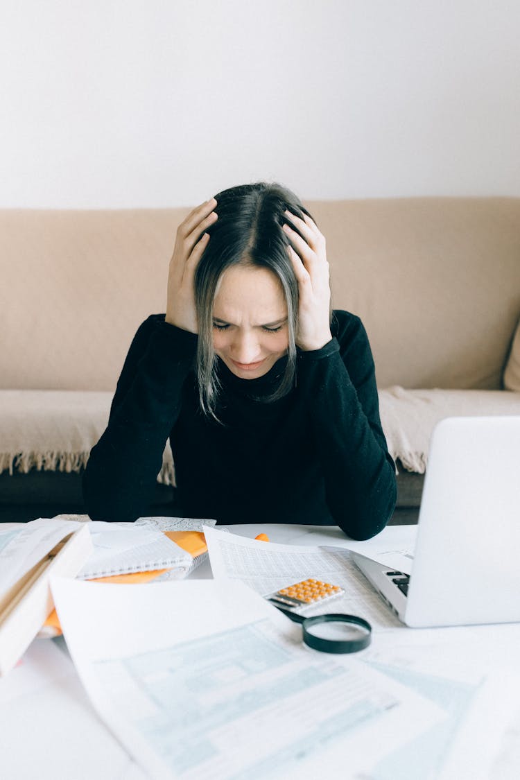 Exhausted Woman Holding Her Head