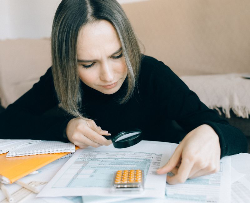 A homeowner reviewing their property tax assessment notice at a kitchen table
