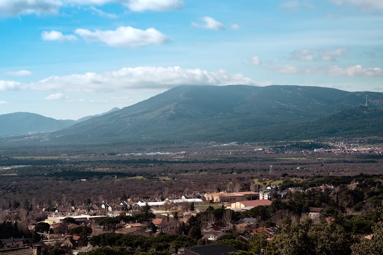 View Of Mountain And Flat Land Under Blue Sky