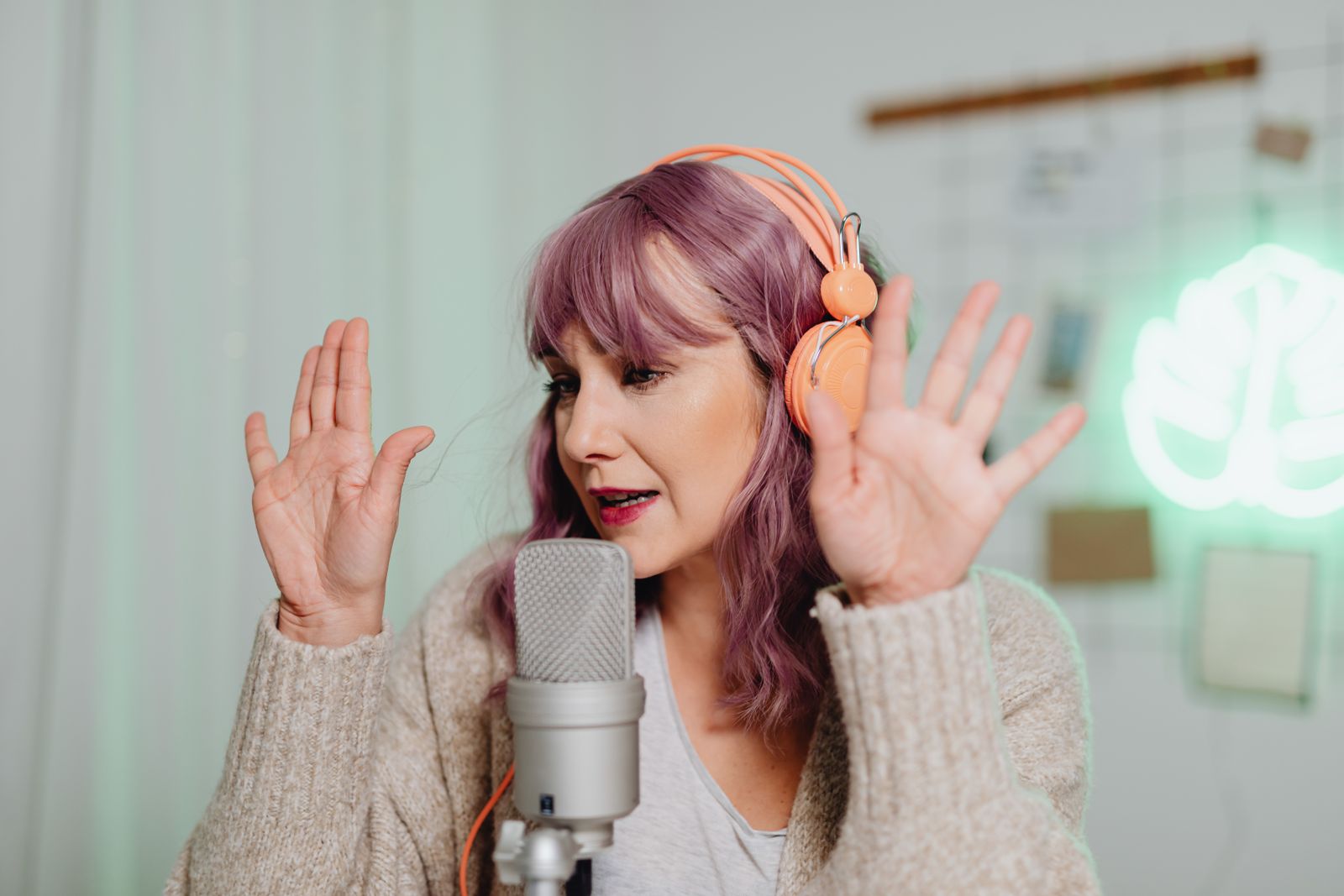 A podcaster speaking into a microphone, illustrating independent audio
