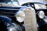 Grayscale Photo of Vintage Car