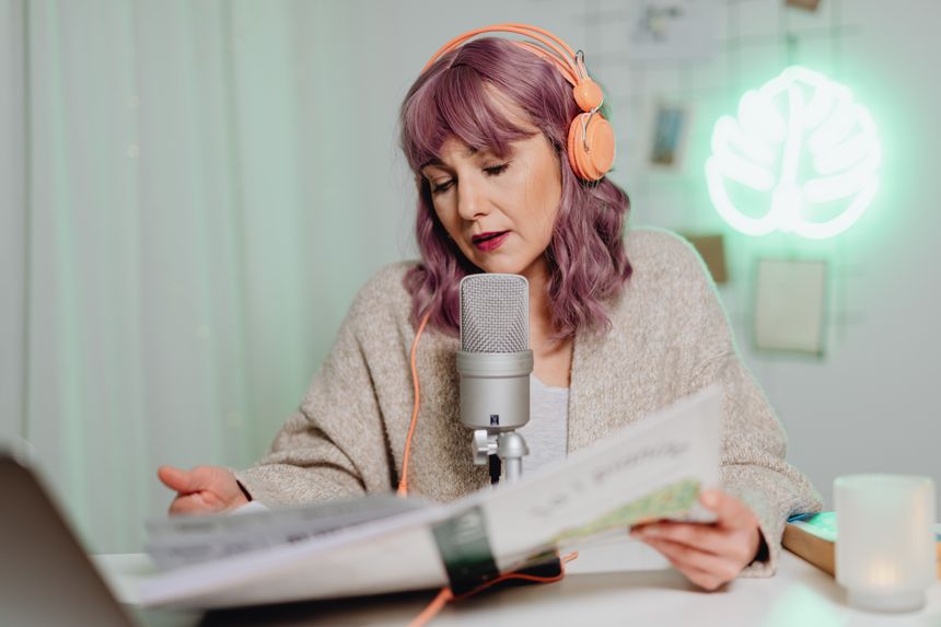 Host recording at a microphone — photo by Kaboompics.com on Pexels