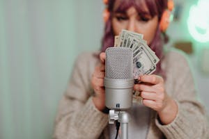 A Woman Holding US Dollar Bill