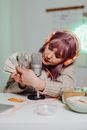Woman in Gray Sweater Holding Dollor Bills