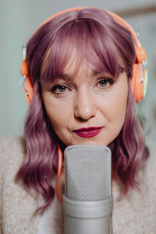 A Woman with a Headset and Microphone