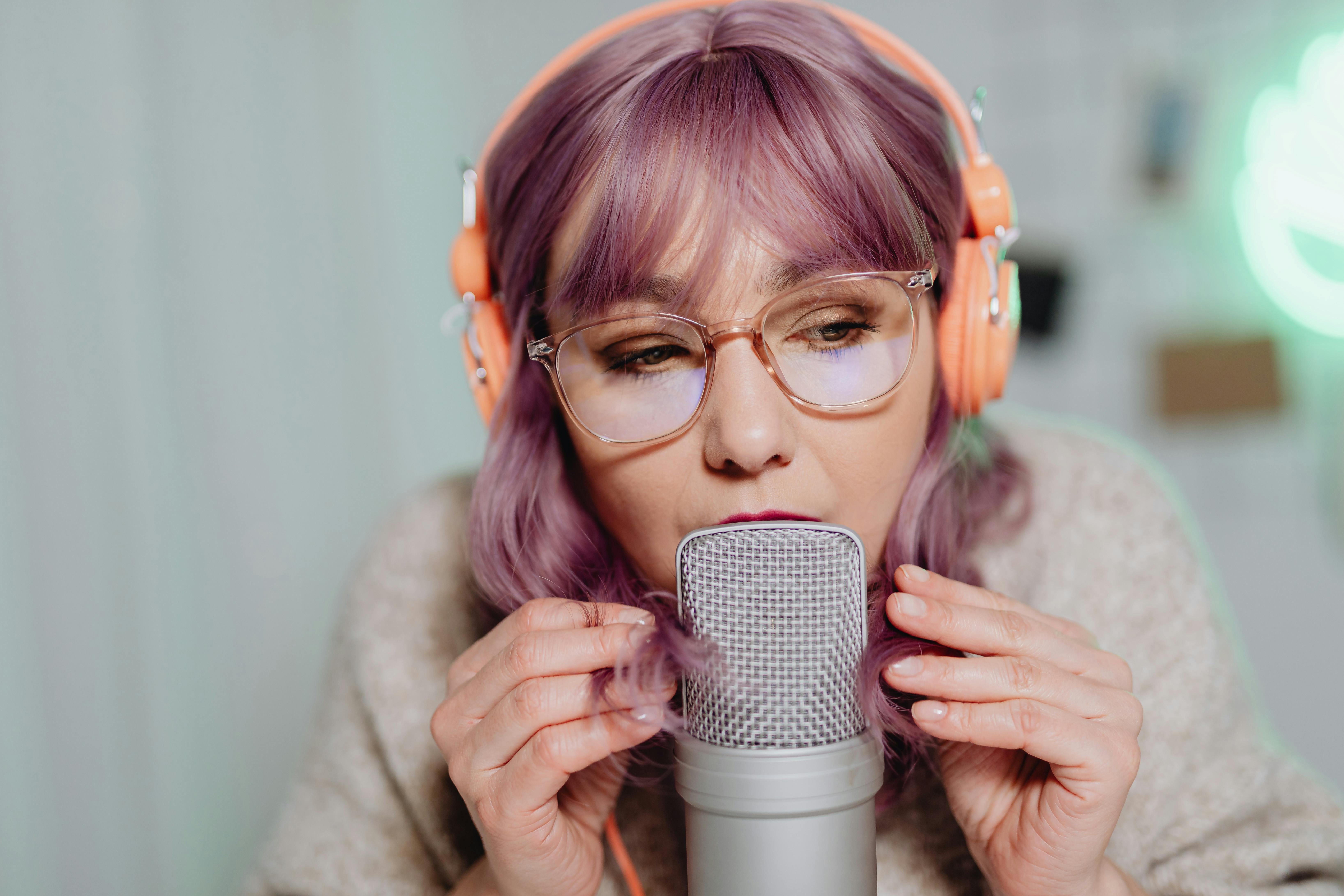 a woman talking to a microphone