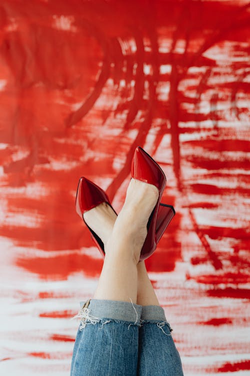 Free A Woman Wearing Red Leather Peep Toe Pumps Stock Photo