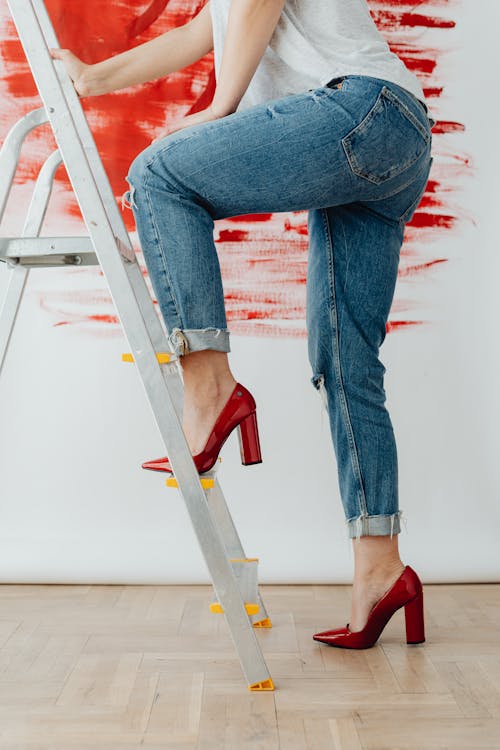 Hills of a Woman while Climbing a Ladder