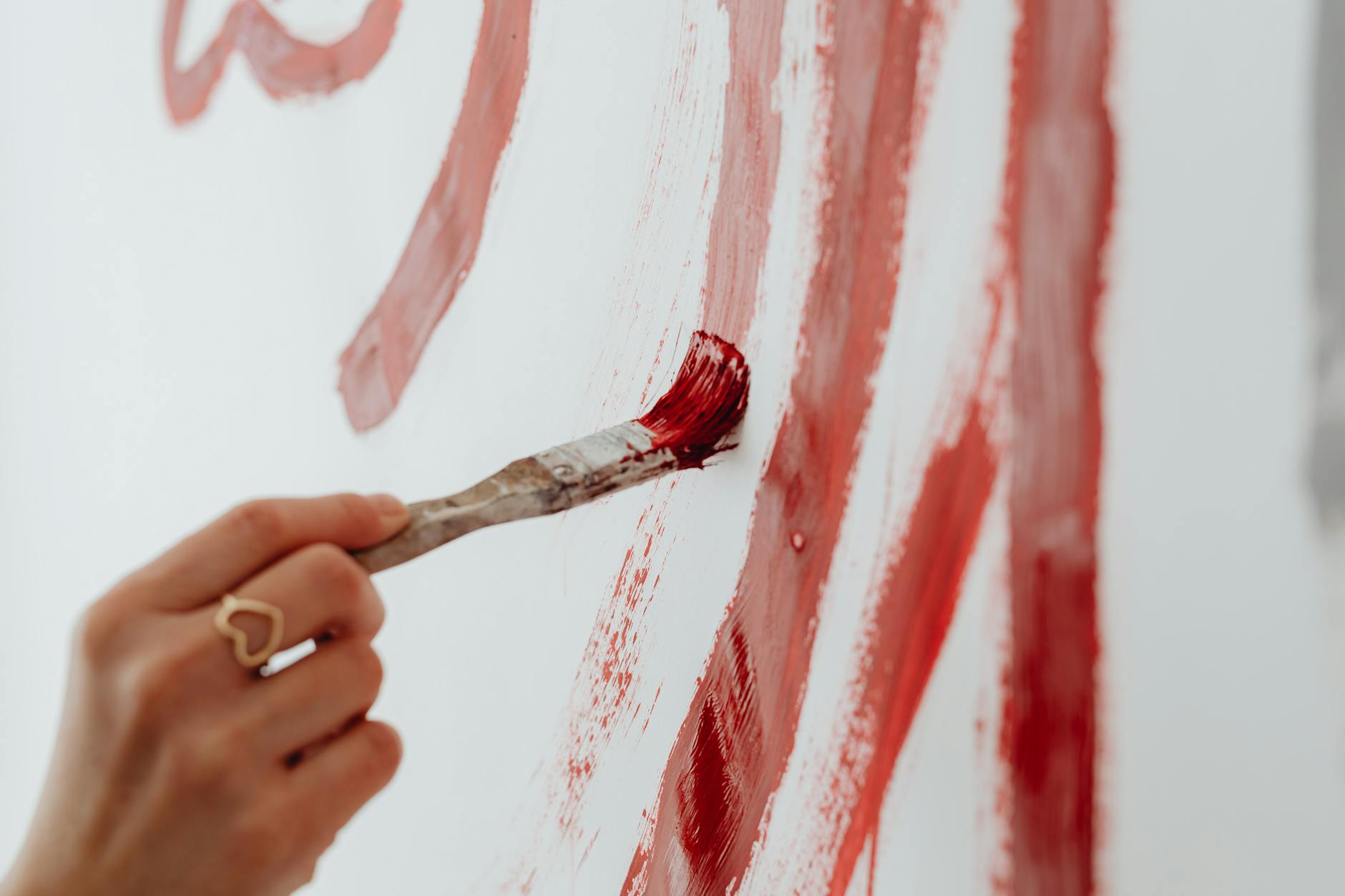 Close-up of a Hand Holding a Paintbrush