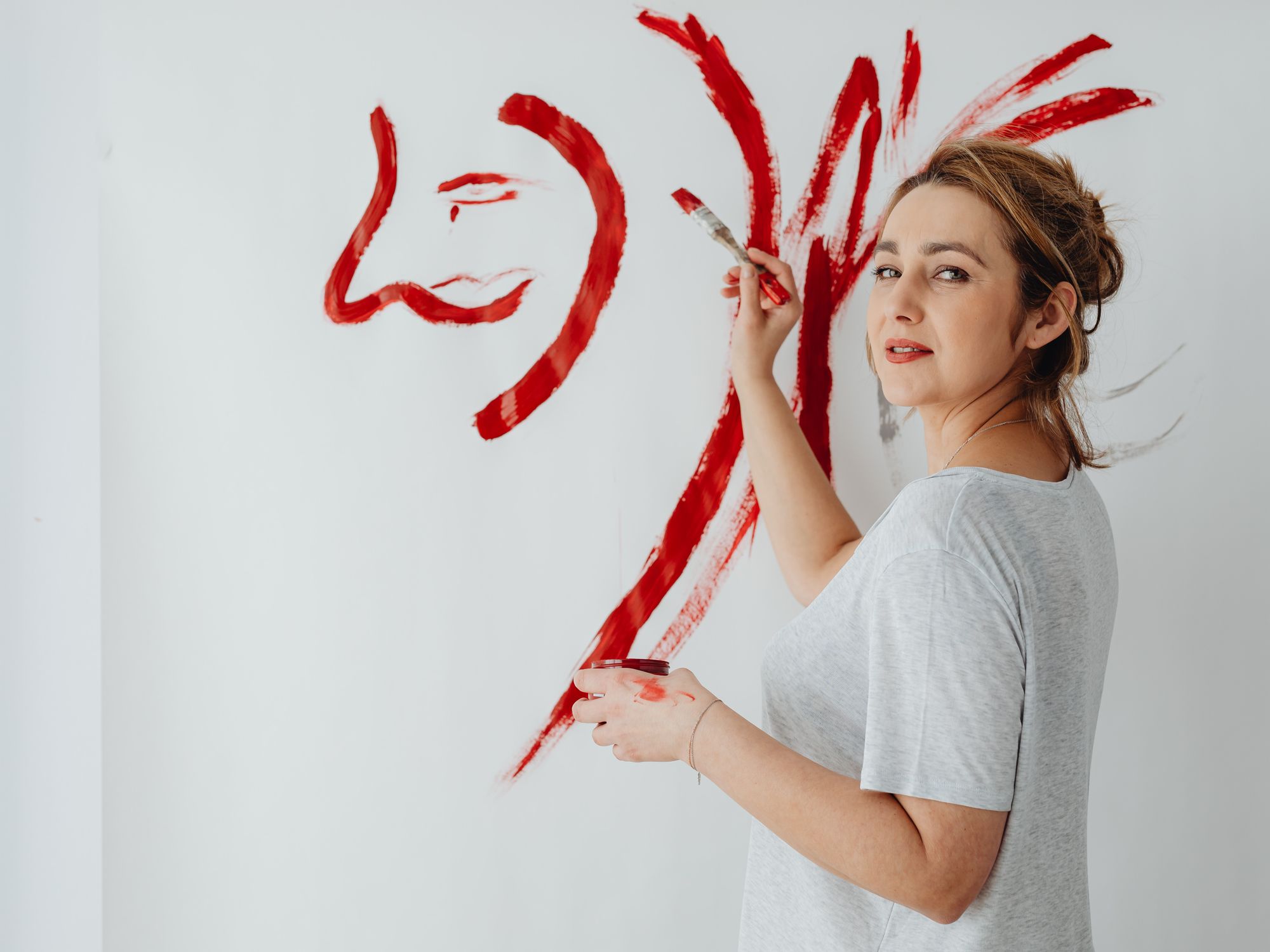 Painters & Decorators in Selsdon, London — professional decorator painting a wall with a roller