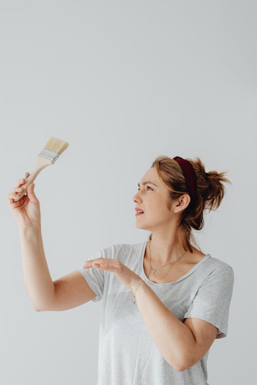 Free Woman Holding a Paintbrush Stock Photo