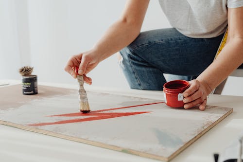 Free Person in a Gray Shirt Painting Stock Photo