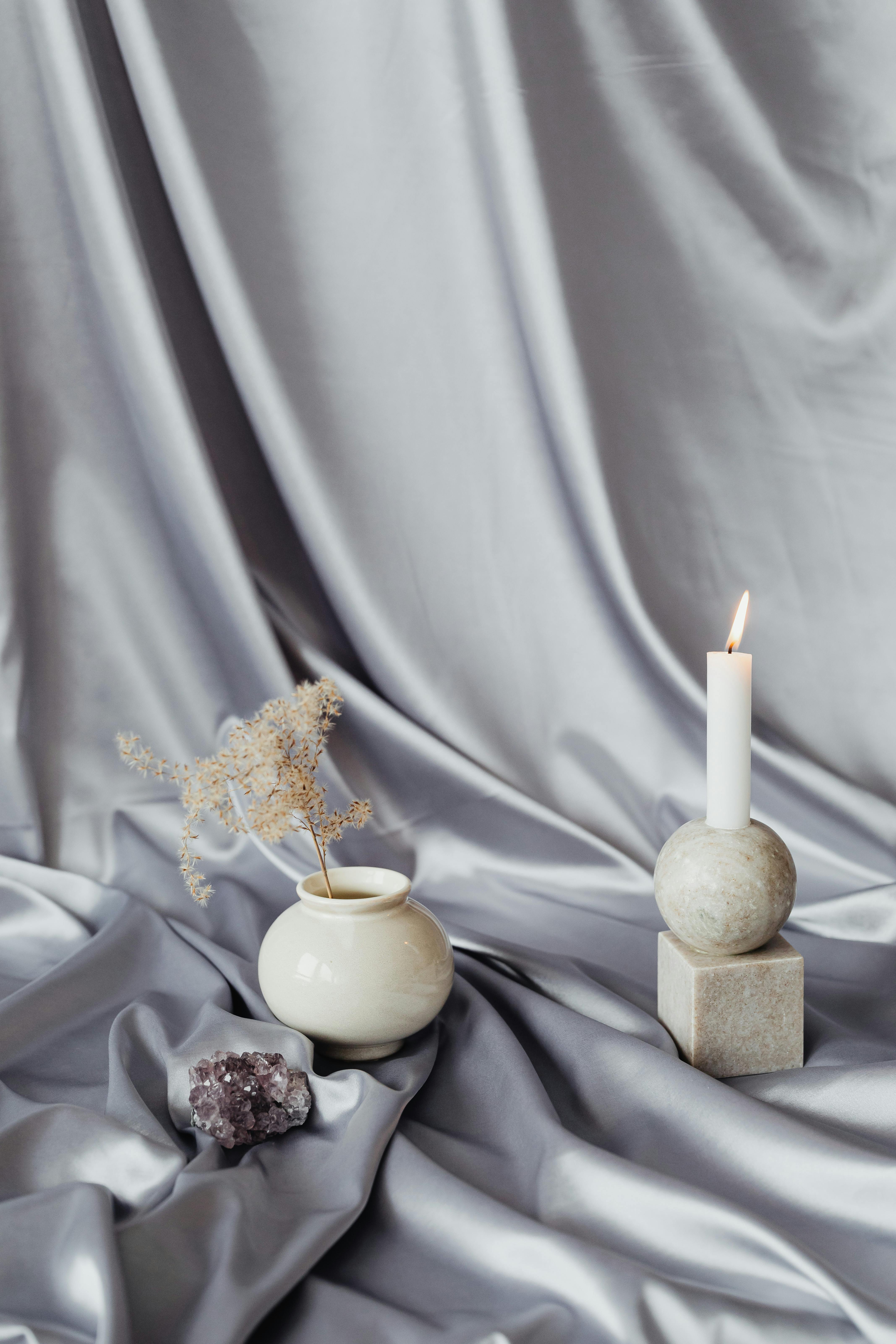 still life with silver a drape and candle