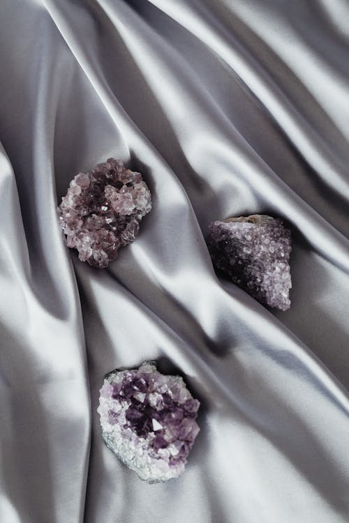 Still Life with Purple Mineral Stones on a Silver Drape