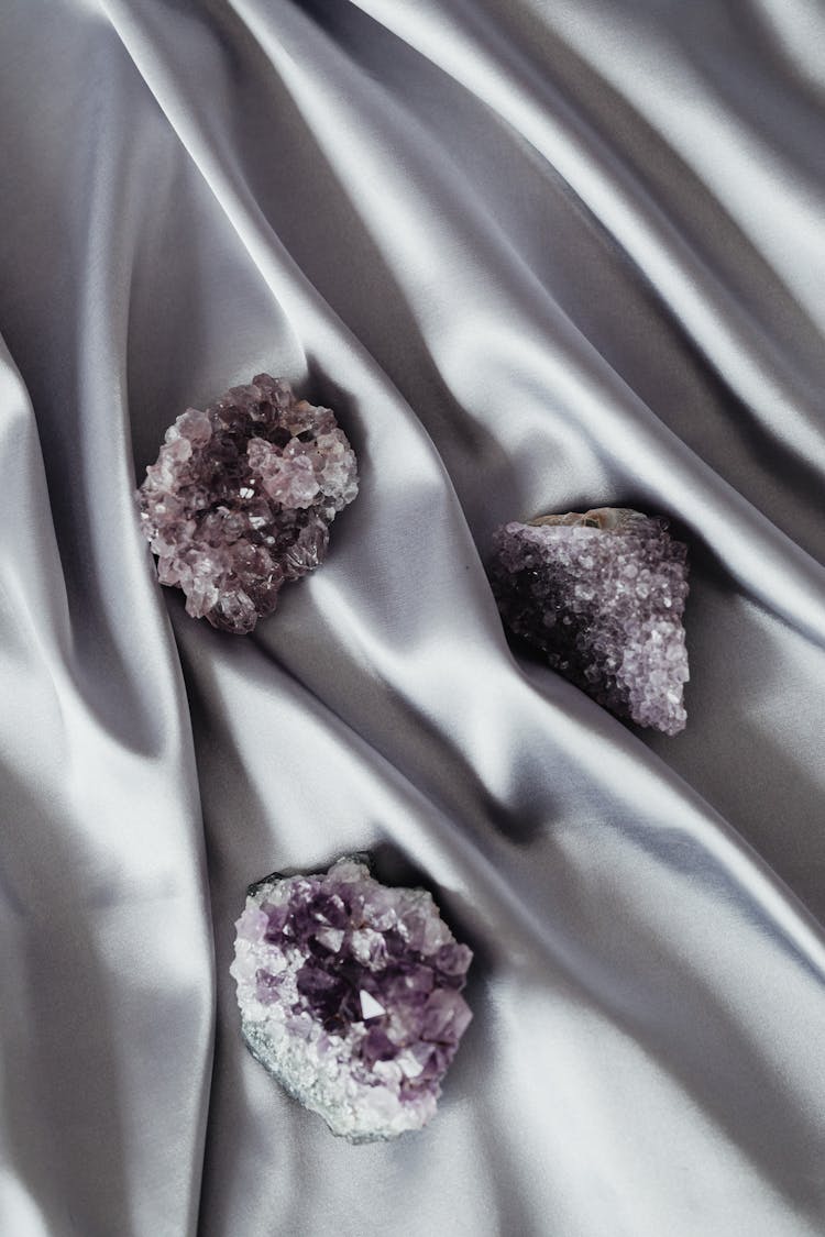 Still Life With Purple Mineral Stones On A Silver Drape