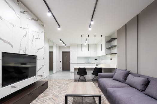 Explore a sleek, modern living room with minimalist design elements and a neutral palette.