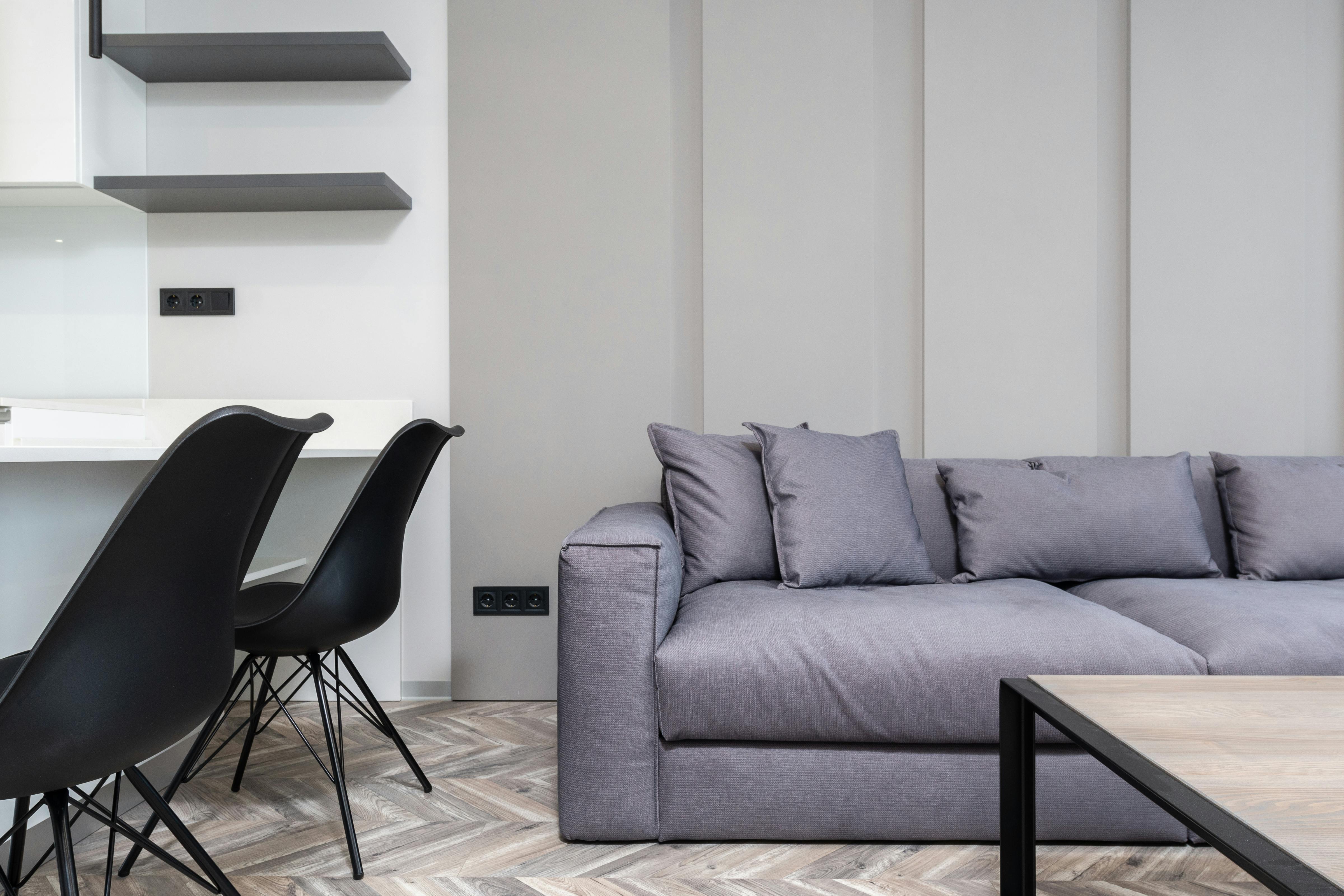 Stylish modern living room featuring sleek furniture and minimalist decor.