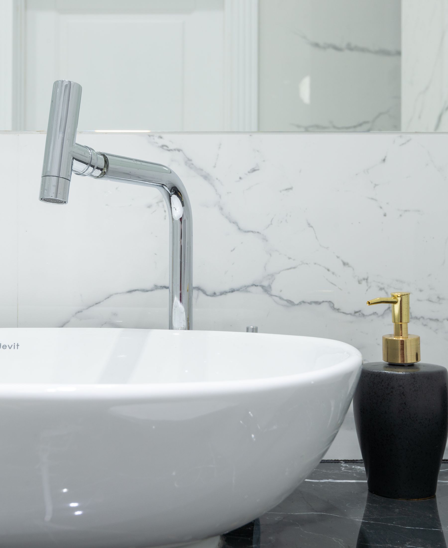 Minimal bathroom sink with chrome faucet