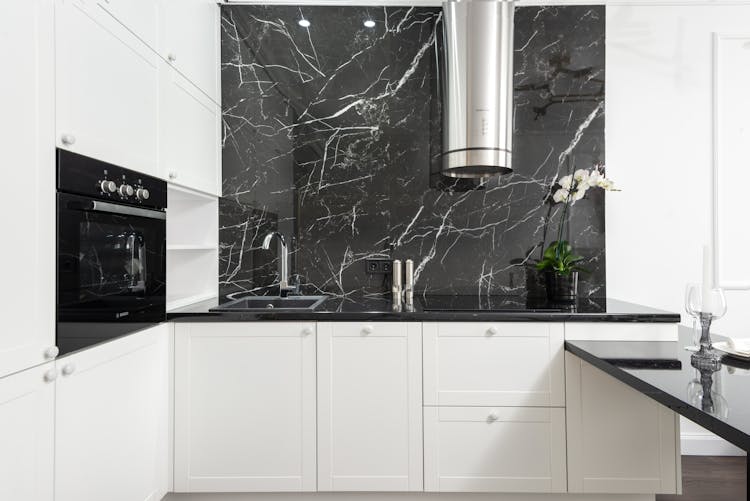 Modern Kitchen Design With A Black Marble Wall 