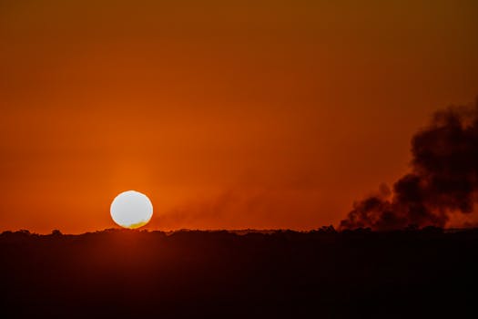 Stunning sunset in João Pessoa with fiery sky creating a breathtaking silhouette.