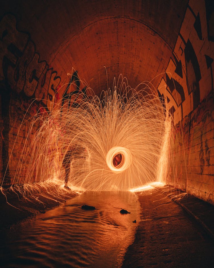 Anonymous Person In Bright Freeze Light With Wavy Rays