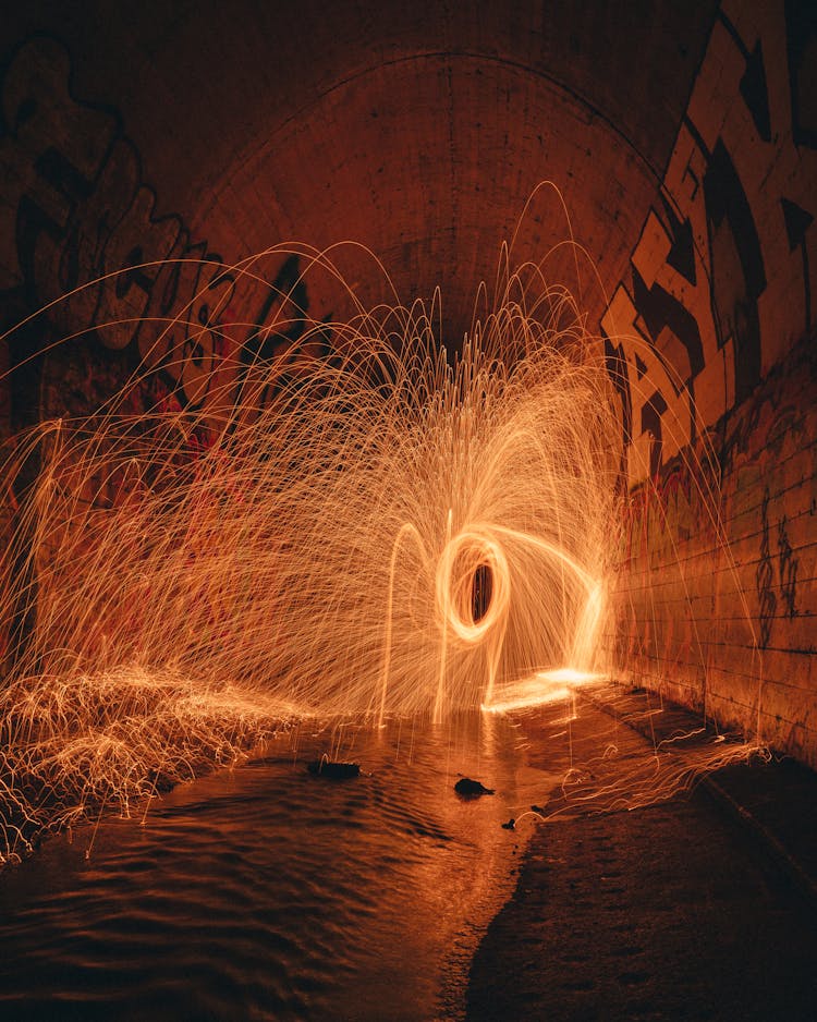 Bright Freeze Light In Tunnel With Graffiti Walls At Night