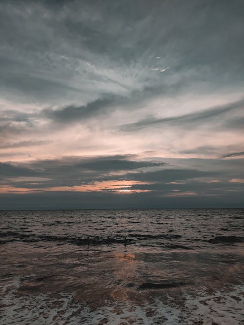 Free Body of Water Under Cloudy Sky Stock Photo