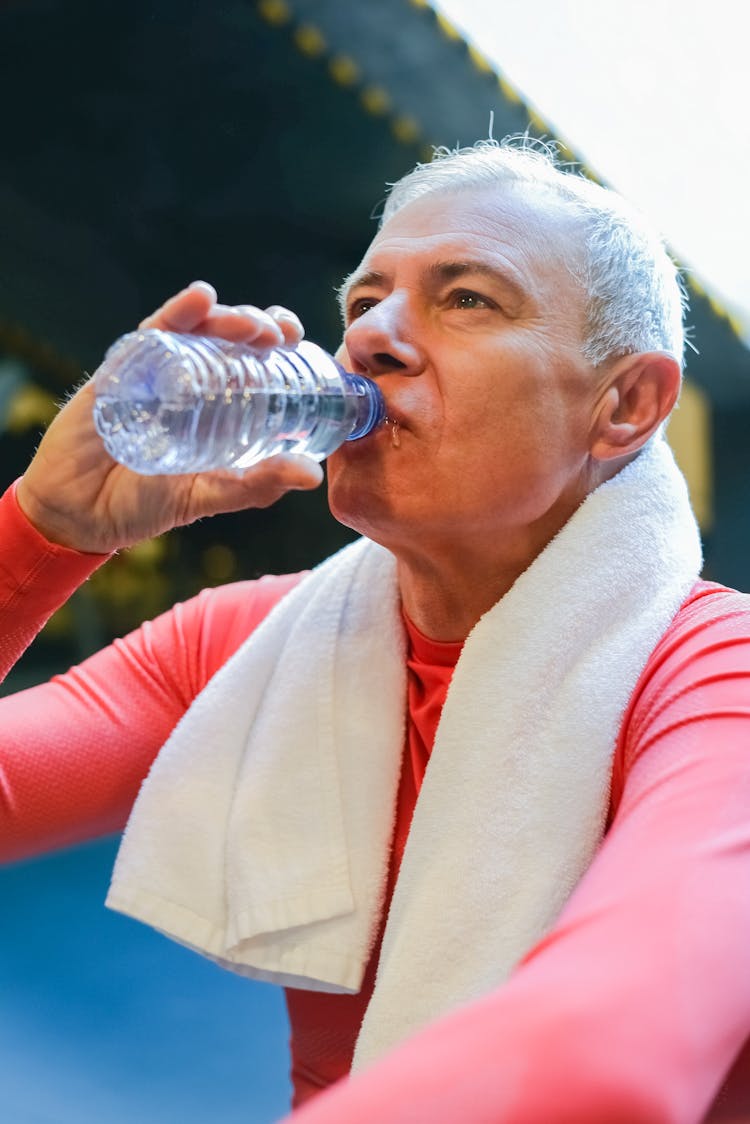 An Elderly Man Drinking Water