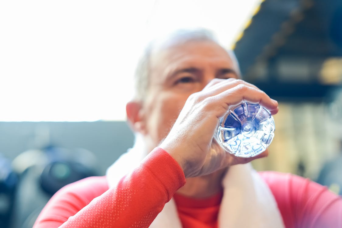 Free Man Drinking Water from the Bottle Stock Photo