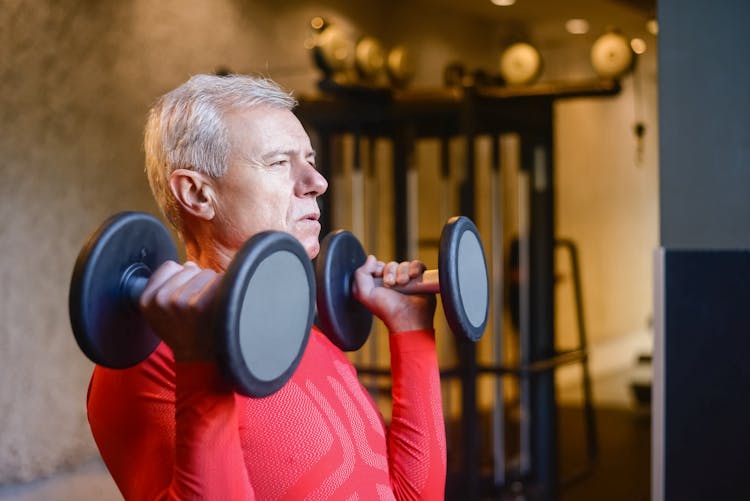 Elderly Man Lifting Dumbbells