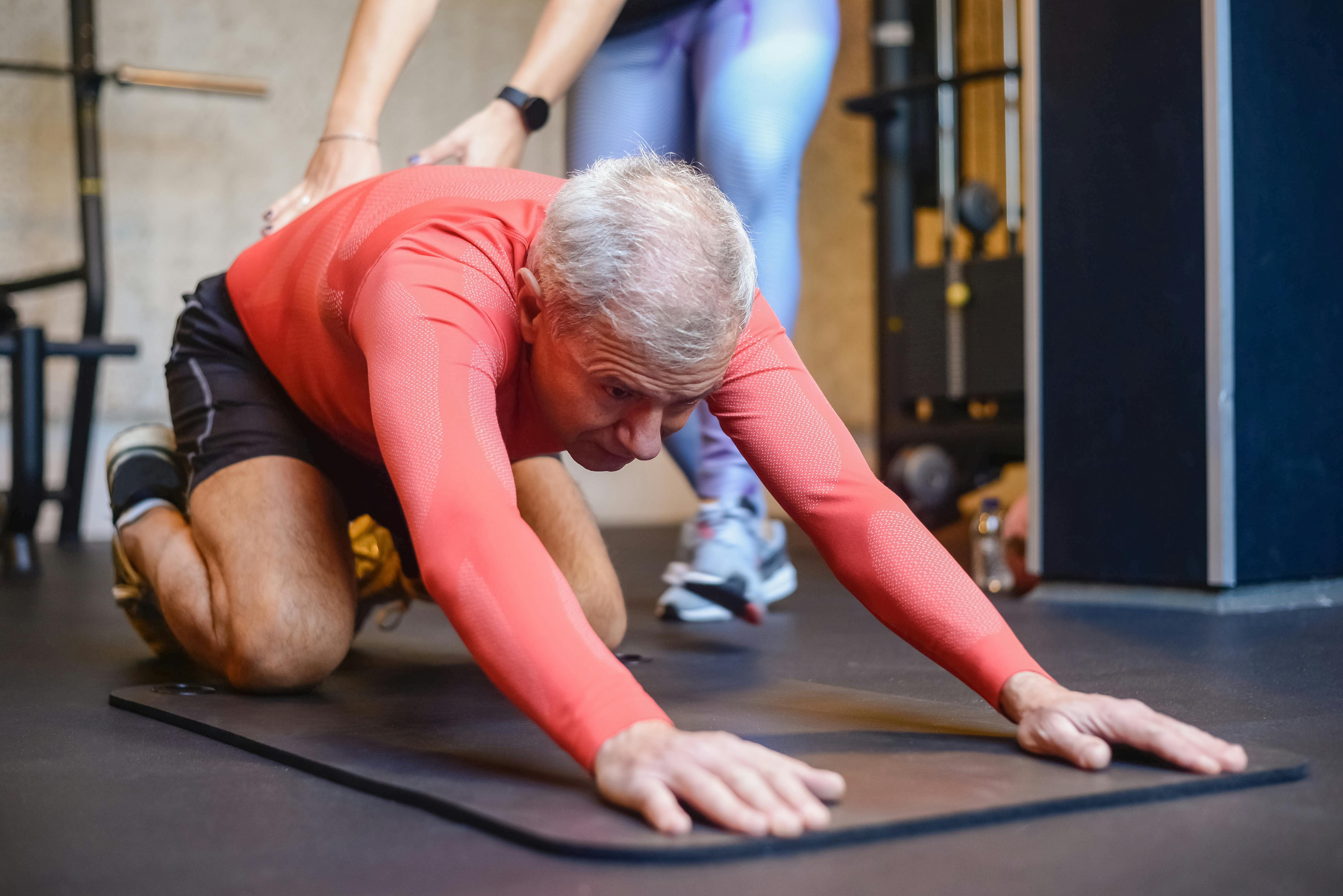 elderly man stretching his body