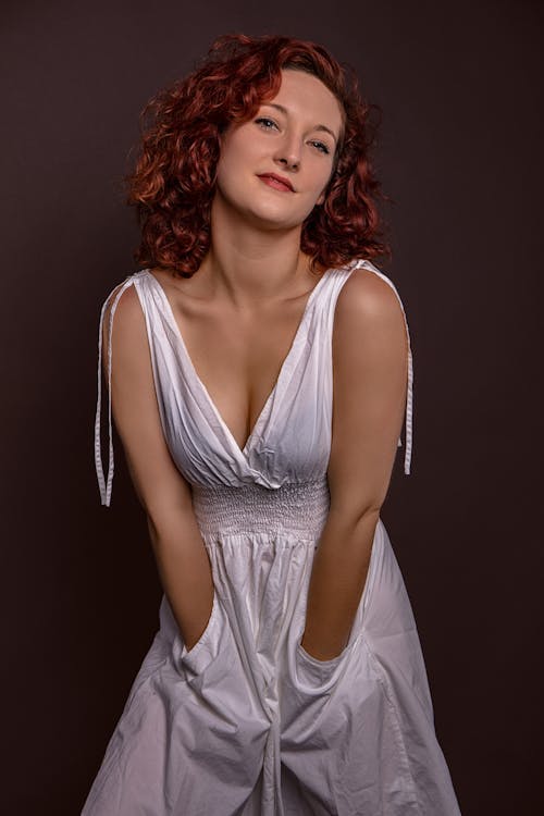 Free A Woman Wearing a White Dress with Pockets Stock Photo