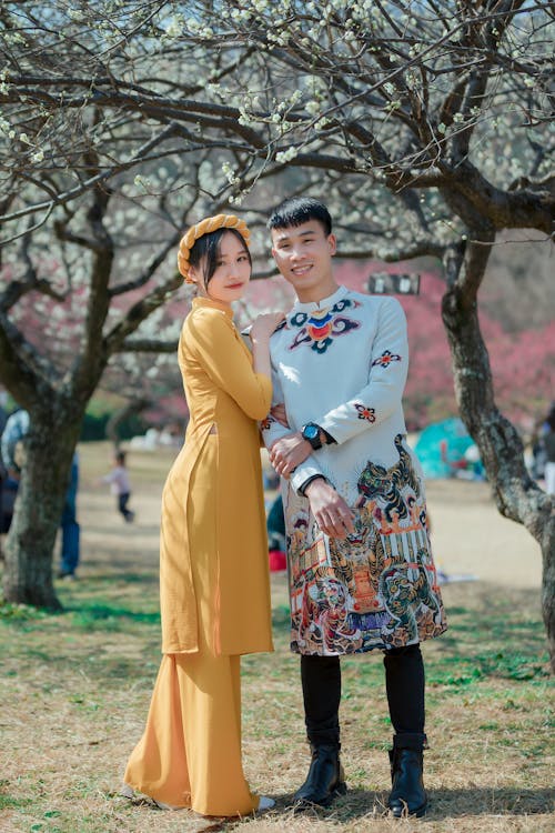 Free Man and Woman Posing Under the Tree Stock Photo