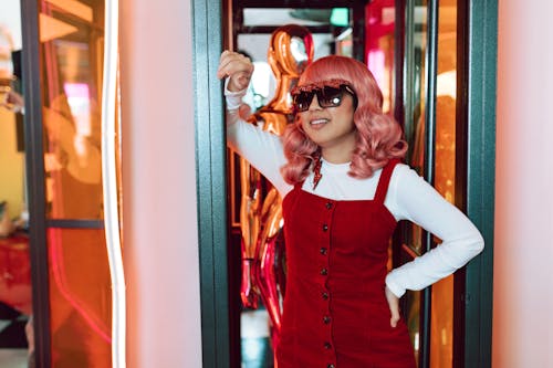 A Woman Wearing a Wig and Sunglasses