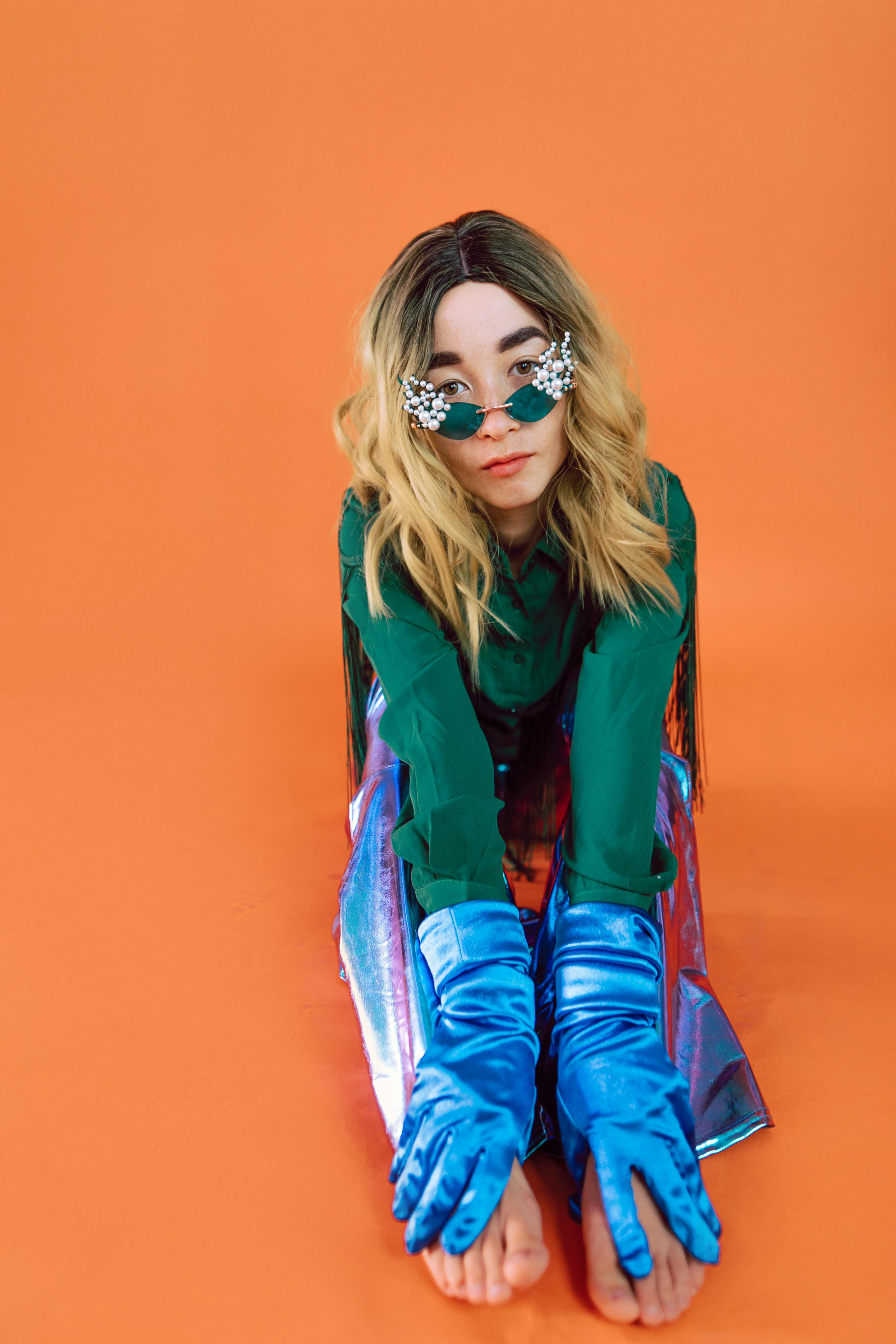 woman in red and blue plaid dress shirt wearing sunglasses