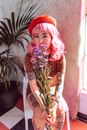 Woman in Red and Black Floral Long Sleeve Shirt With Red Hair