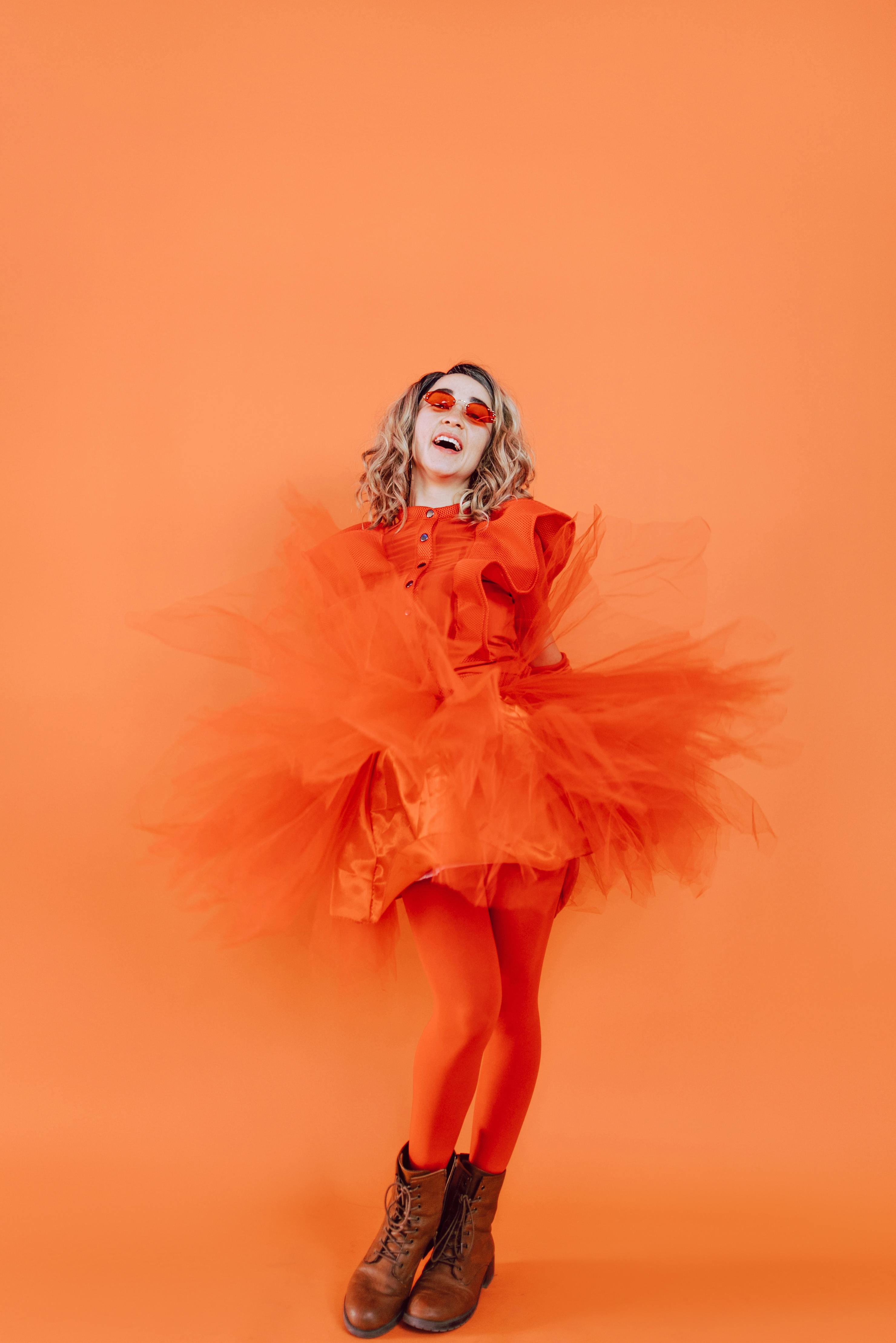 woman in white and orange dress