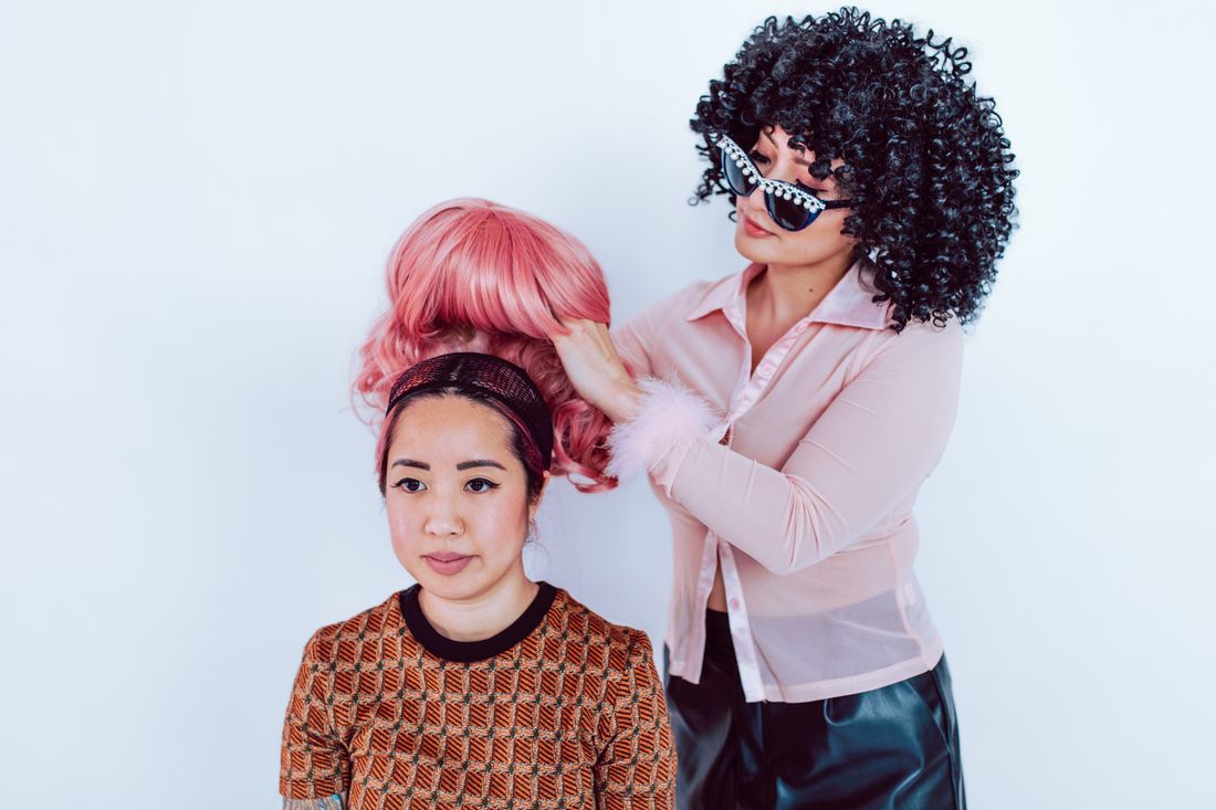 Black woman with styled wig in salon