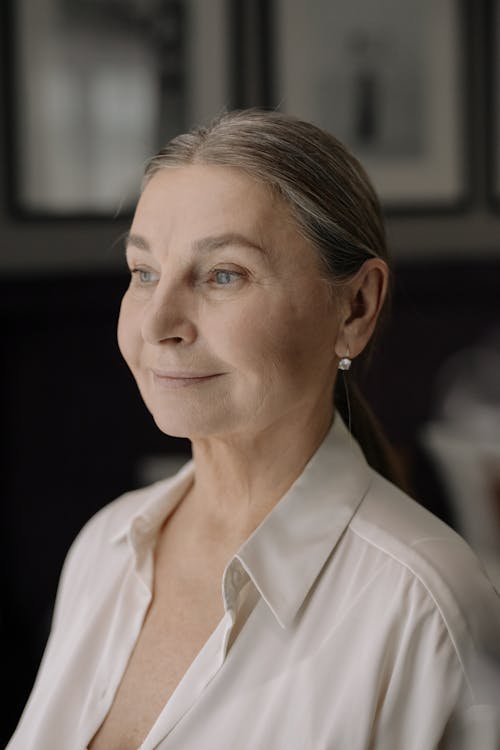 Woman in White Collared Shirt Smiling