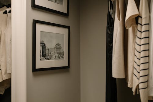 Free Framed Vintage Photos Hanging in a Wall Stock Photo