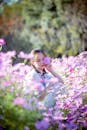 Girl with her Eyes Closed in a Flower Field