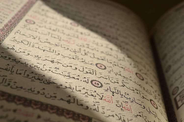 Close Up Of Book Pages With Arabic Script And Digits