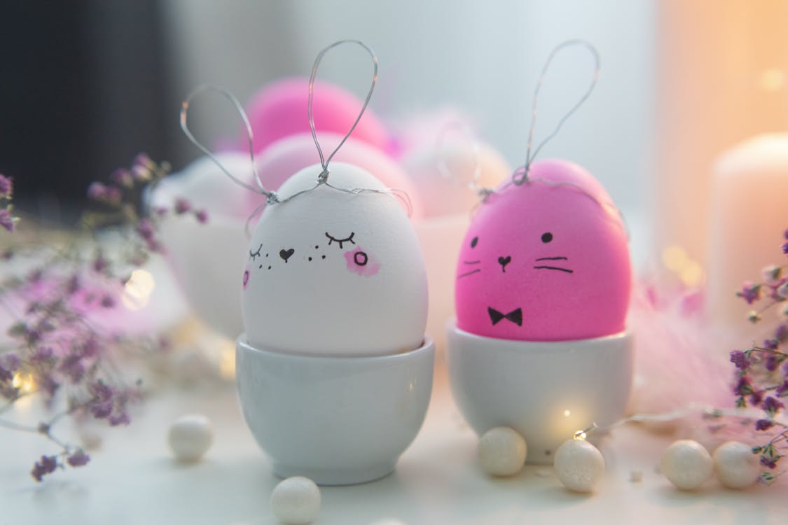 Free Pink and White Easter Bunny Eggs On Ceramic Cups Stock Photo