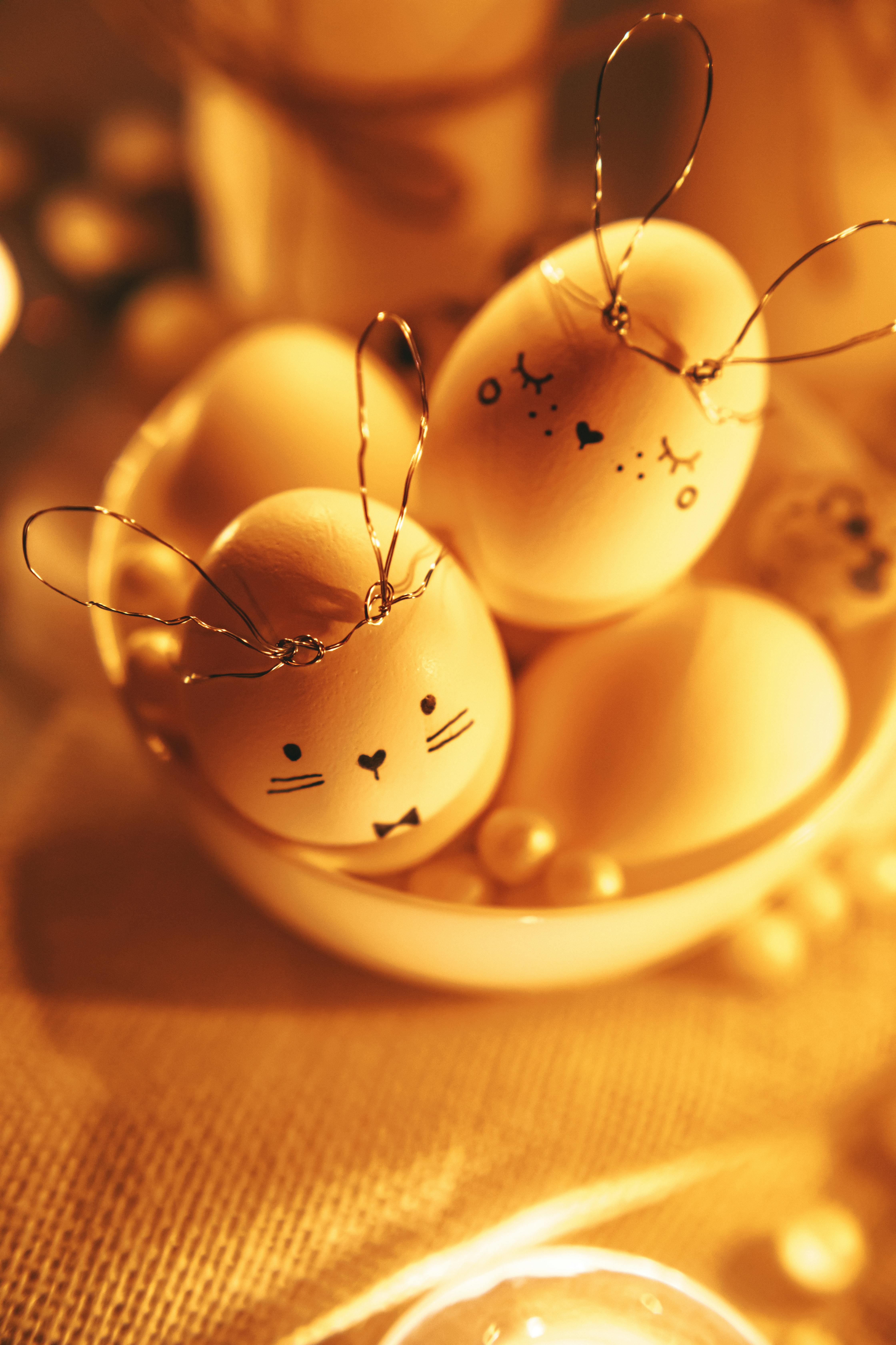 white decorated eggs in golden background