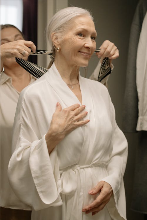 A Woman in White Robe Smiling