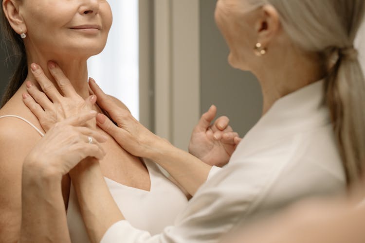 A Woman Touching Her Partner's Neck