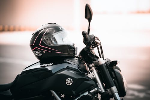 Free Black and Gray Motorcycle With Helmet Stock Photo