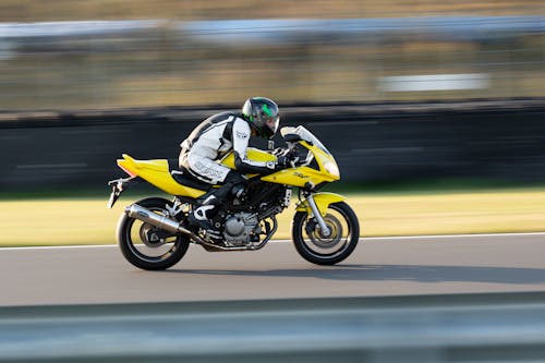 Free A Racer in a Yellow Motorcycle Stock Photo
