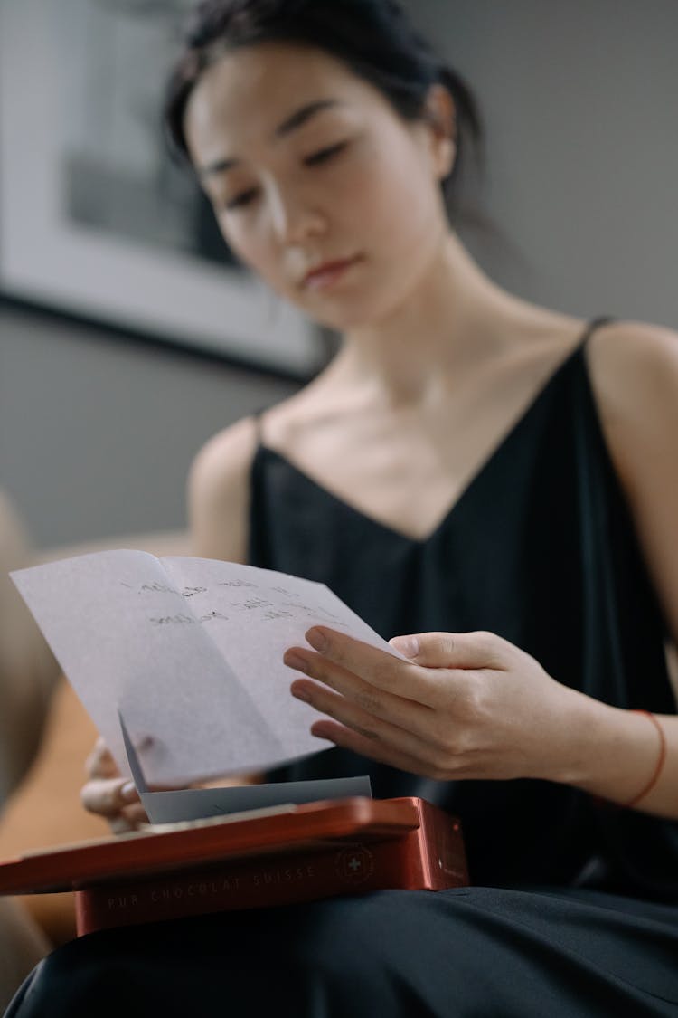 A Woman Reading A Letter